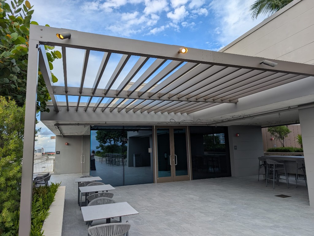 Custom aluminum rooftop pergola over an outdoor lounge